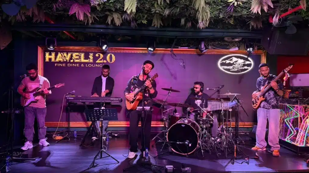 Live music performance at Haveli lounge, signing merch for guests.