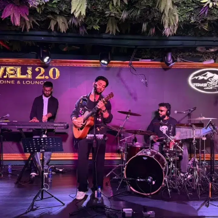 Live music performance at Haveli lounge, signing merch for guests.